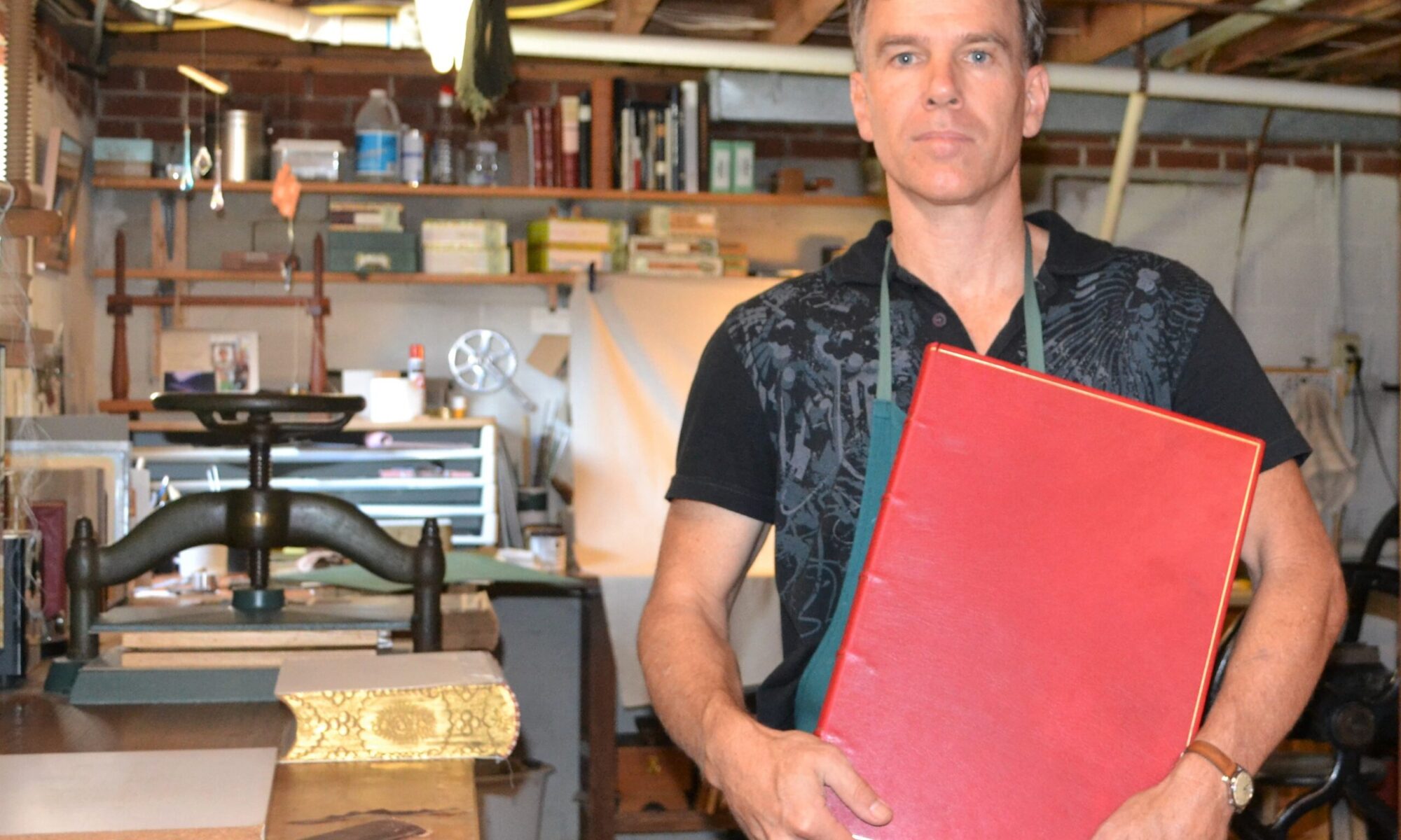 the binder in his workshop